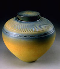 lidded yellow carved vessel