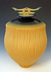 lidded yellow tall carved vessel 