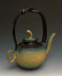 yellow carved teapot
